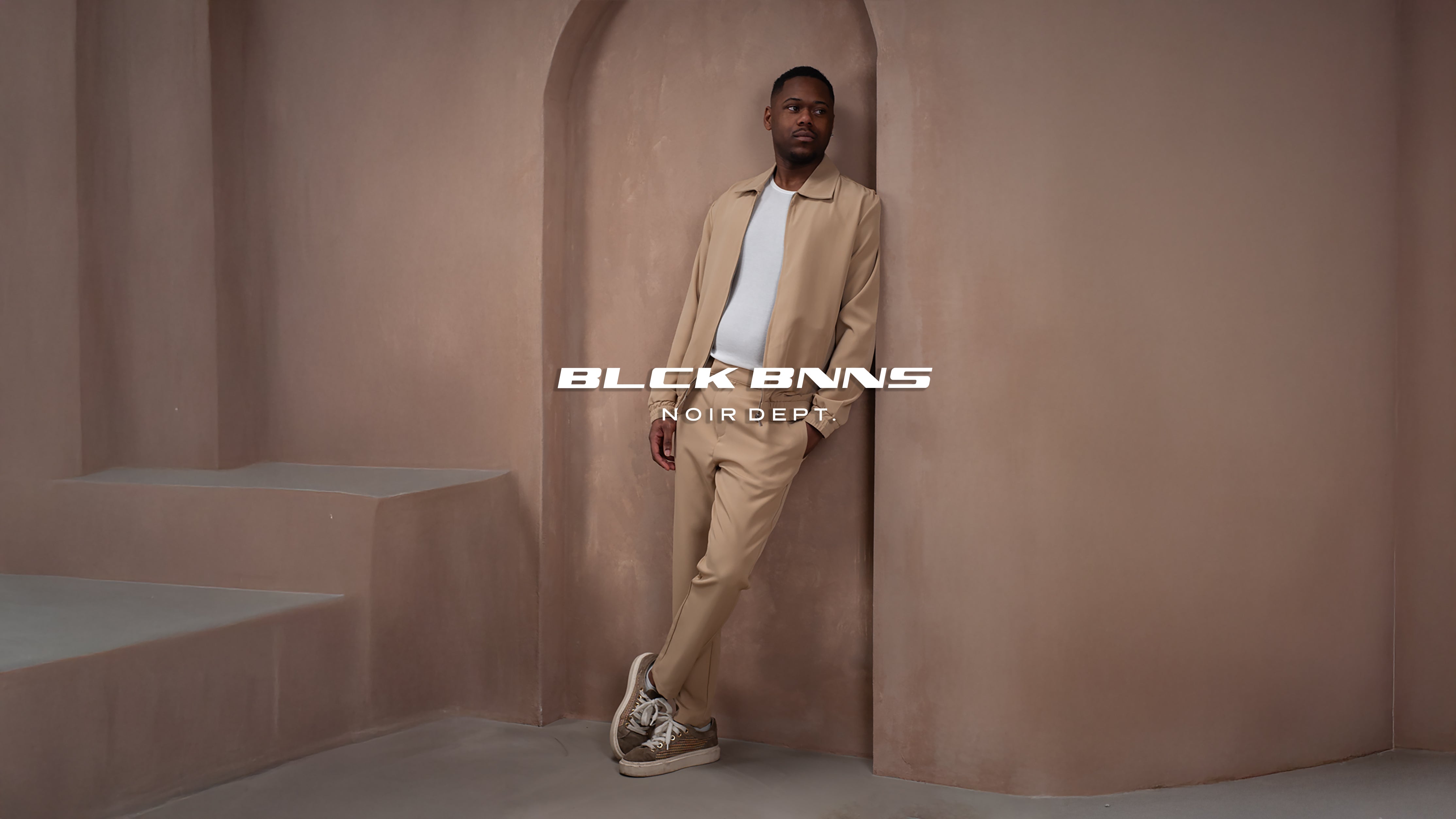 //blackbananas.com/cdn/shop/files/banner_noir_dept_tracksuit.jpg?v=1770718046